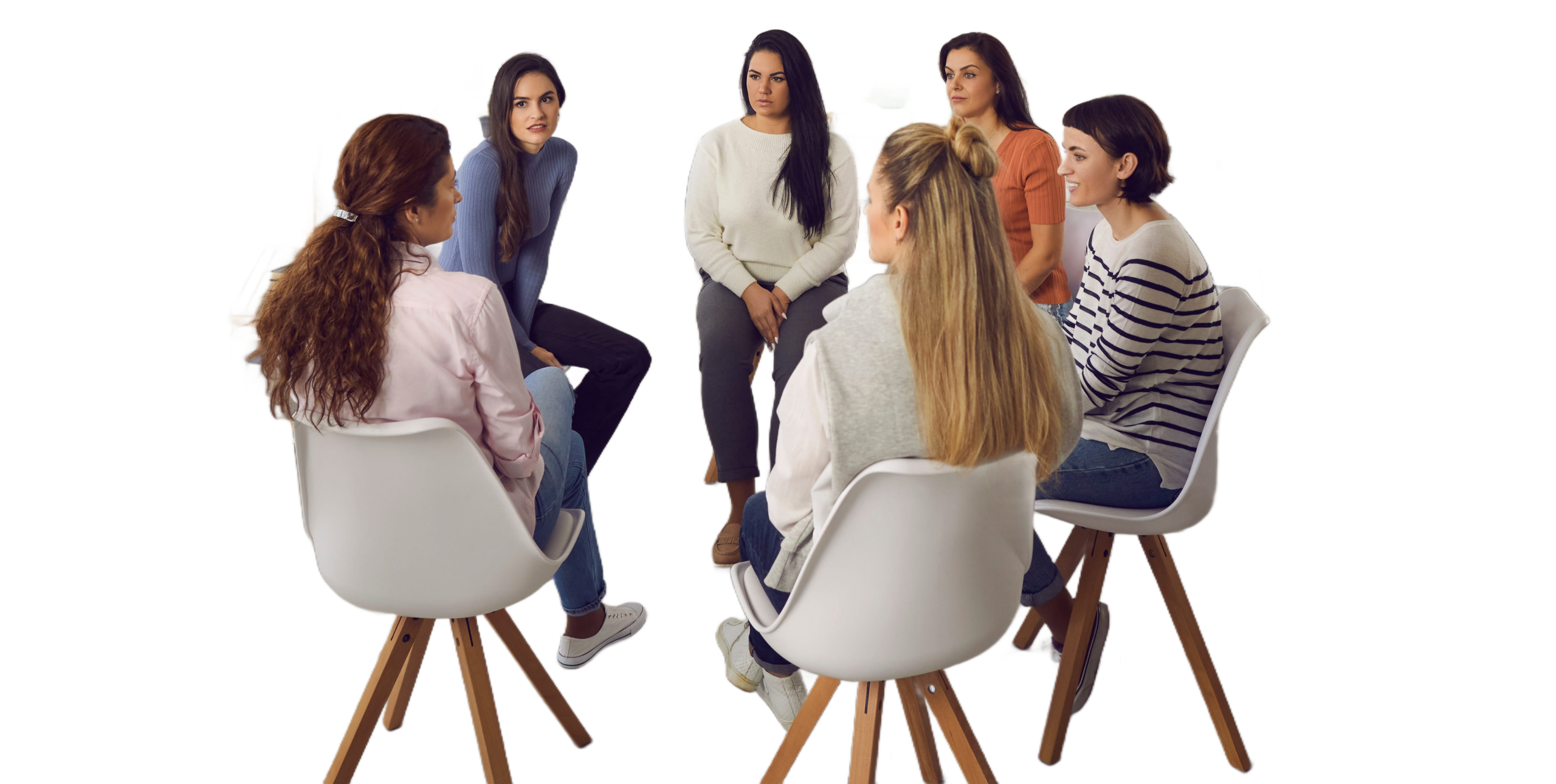 Group therapy participants sitting together in a counseling session